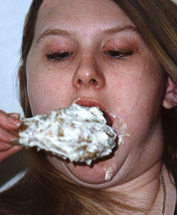 Selma, AL, eater Barb Hodges swallows a chicken drumstick with the aid of Hellmann's QX-1.